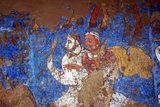The Afrasiab painting is a rare example of Sogdian art. It was discovered in 1965 when the local authorities decided on the construction of a road through the middle of Afrāsiāb mound, the old site of pre-Mongol Samarkand. It is now preserved in a special museum on the Afrāsiāb mound. It is the main painting we have of ancient Sogdian art.<br/><br/>

The painting dates back to the middle of the 7th century CE. On the four walls of the room of a private house, three or four different countries neighbouring Central Asia are depicted. On the northern wall China (a Chinese festival, with the Empress on a boat, and the Emperor hunting), on the Southern Wall Samarkand (the Iranian world: a religious funerary procession in honor of the ancestors during the Nowruz festival), on the eastern wall India (as the land of the astrologers and of the pygmies, but the painting is much destroyed there).<br/><br/>

The topic on the main wall, the western wall facing the entrance is debated between specialists. Turkish soldiers are escorting ambassadors coming from various countries of the world (Korea, China, Iranian principalities, etc). There are three main hypotheses. The leading expert on Sogdian painting, the excavator of Panjikent, B. Marshak points out that Sogdian painting, gods are always depicted on the top of the main wall. However, as the Turks are guiding the embassies but are not themselves ambassadors, it has been suggested also that the Turkish Qaghan, then lord of inner and central Asia, might be depicted there.<br/><br/>

A Chinese text states that  the 'Four Lords of the World', here China, India, Iran and Turan, are depicted on the walls of palaces near Samarkand precisely during this period, and this would perfectly fit the four walls of this room. The last hypothesis makes use of an inscription mentioning the king of Samarkand to propose the idea that the ambassadors are presenting their gifts to him.