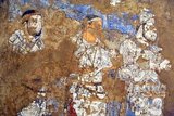 The Afrasiab painting is a rare example of Sogdian art. It was discovered in 1965 when the local authorities decided on the construction of a road through the middle of Afrāsiāb mound, the old site of pre-Mongol Samarkand. It is now preserved in a special museum on the Afrāsiāb mound. It is the main painting we have of ancient Sogdian art.<br/><br/>

The painting dates back to the middle of the 7th century CE. On the four walls of the room of a private house, three or four different countries neighbouring Central Asia are depicted. On the northern wall China (a Chinese festival, with the Empress on a boat, and the Emperor hunting), on the Southern Wall Samarkand (the Iranian world: a religious funerary procession in honor of the ancestors during the Nowruz festival), on the eastern wall India (as the land of the astrologers and of the pygmies, but the painting is much destroyed there).<br/><br/>

The topic on the main wall, the western wall facing the entrance is debated between specialists. Turkish soldiers are escorting ambassadors coming from various countries of the world (Korea, China, Iranian principalities, etc). There are three main hypotheses. The leading expert on Sogdian painting, the excavator of Panjikent, B. Marshak points out that Sogdian painting, gods are always depicted on the top of the main wall. However, as the Turks are guiding the embassies but are not themselves ambassadors, it has been suggested also that the Turkish Qaghan, then lord of inner and central Asia, might be depicted there.<br/><br/>

A Chinese text states that  the 'Four Lords of the World', here China, India, Iran and Turan, are depicted on the walls of palaces near Samarkand precisely during this period, and this would perfectly fit the four walls of this room. The last hypothesis makes use of an inscription mentioning the king of Samarkand to propose the idea that the ambassadors are presenting their gifts to him.